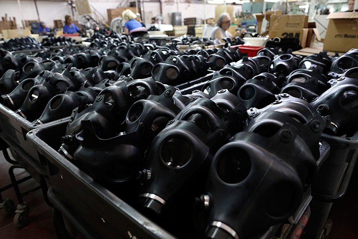 Israel preparations: Israeli workers are seen at the Shalon gas mask factory in Kiryat Gat