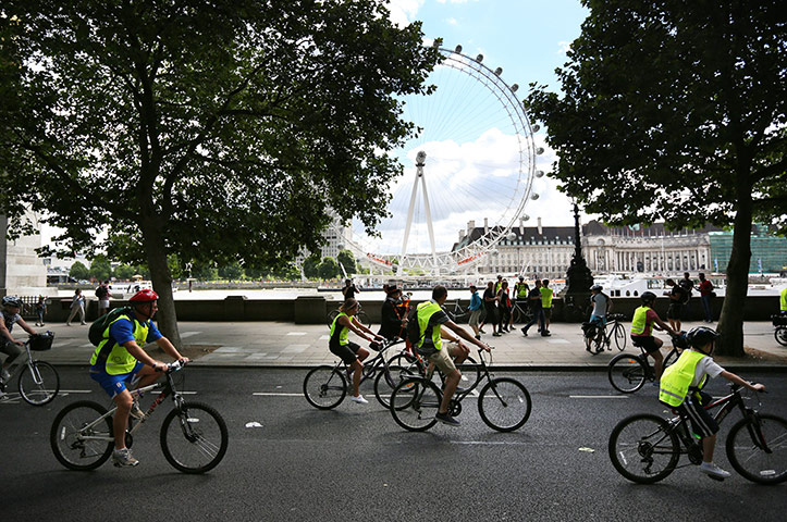 RideLondon: Cyclists pass in sight of the London Eye along the River Thames 