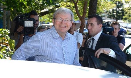 Australian Prime Minister Kevin Rudd smiles as he gets into a car after leaving a cafe with wife Therese Rein in Bulimba, Brisbane.