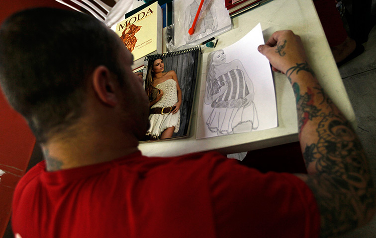 Prison knitting: A prisoner draws a fashion model from a photograph for designer Raquel Guim