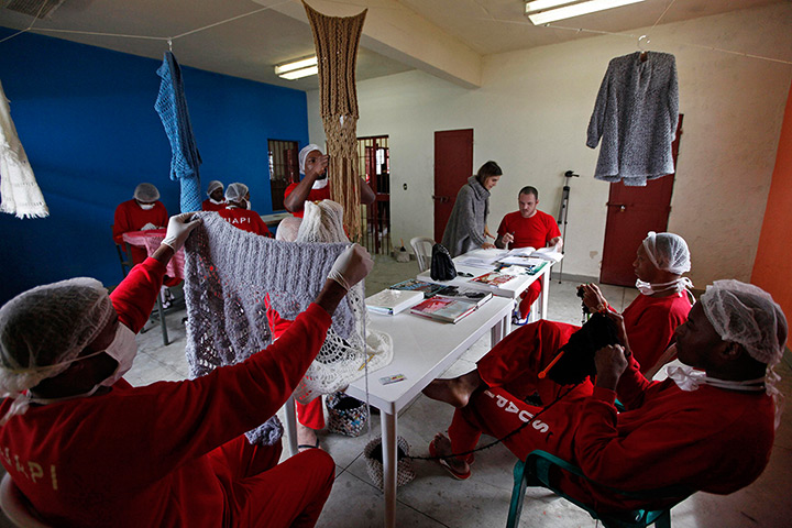 Prison knitting: Raquel Guimaraes (centre, standing) supervises prisoners knitting for her 