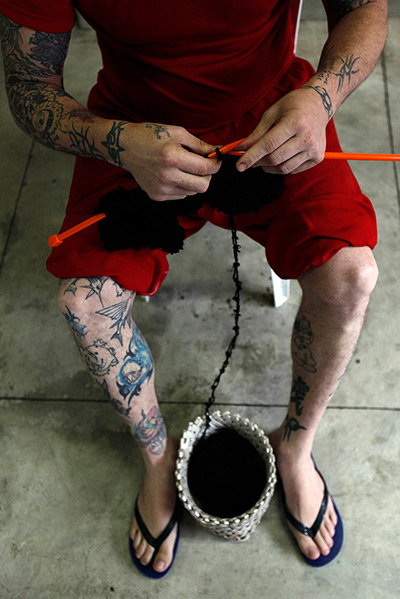 Prison knitting: A prisoner knitting