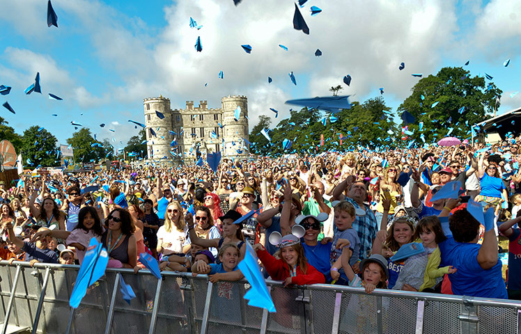 Festivalgoers at Camp Bestival on Saturday attempt to break the world record for most paper planes launched all at once to celebrate the launch of the new Disney film Planes.