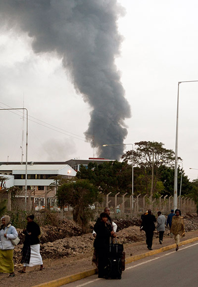 Nairobi airport fire: Travellers with suitcases