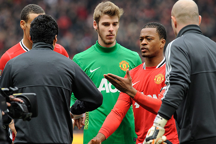 Patrice Evra complains after Suárez refuses to shake hands