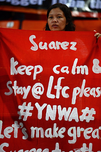 Liverpool fan with banner