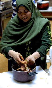 Magda stuffing ox intestines, Cairo, Egypt.
