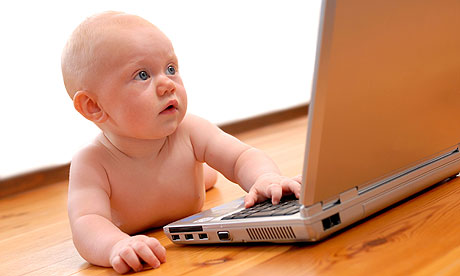 Baby using laptop computer