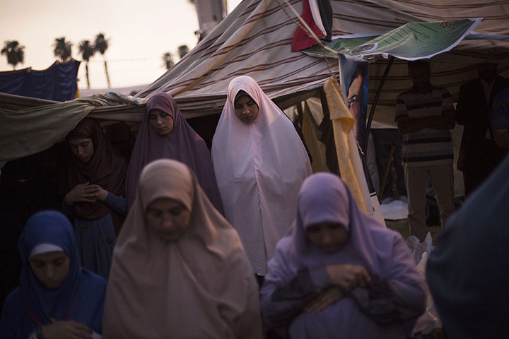 20 Photos: Supporters of Egypt's ousted President Mohammed Morsi pray after Iftar