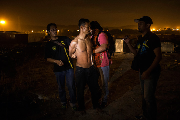 Weekend in pictures: Klang, Malaysia: Suspected illegal foreign workers are arrested by law enfo