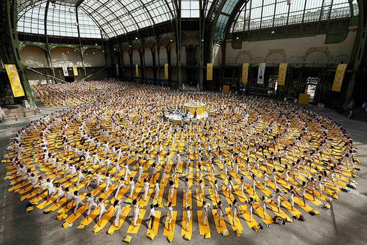 Weekend in pictures: Paris, France: People take part in a group yoga practice at the Grand Palai