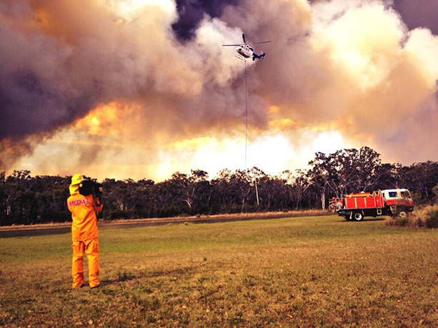 West Sydney bushfires: Helicopter attempting to extinguish a bushfire in Windsor