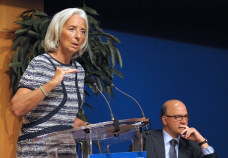 French Finance Minister Pierre Moscovici listens as International Monetary Fund (IMF) Managing Director Christine Lagarde addresses a joint IMF-Treasury seminar at the Economy Ministry in Paris on September 10, 2013 .