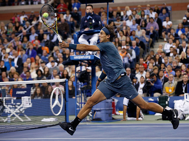 tennis -: Nadal of Spain hits a return to Djokovic of Serbia
