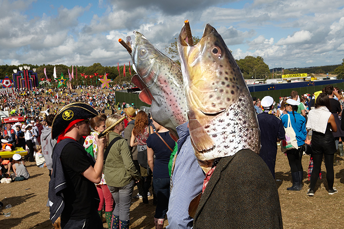 Bestival: Festival goers dressed as a pair of trouts smoking cigars