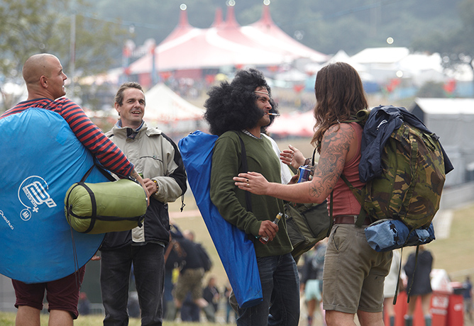 Bestival: People arrive at Bestival with their tents and rucksacks