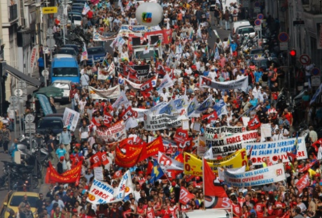 Workers of the private sector and public services demonstrate through the streets of Marseille, southern France, Tuesday, Sept. 10, 2013, as they protest against the government pension reforms. (AP Photo/Claude Paris)