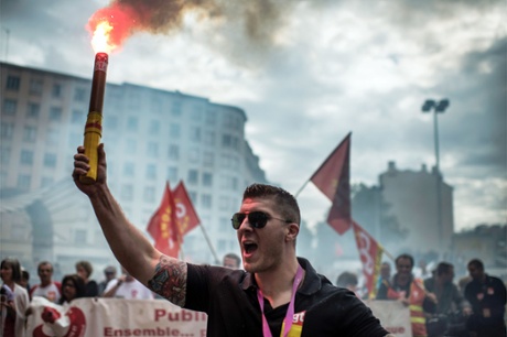 People march as part of a nationwide day of protest against the government's plans to reform France's debt-ridden pension system, on September 10, 2013 in Lyon.