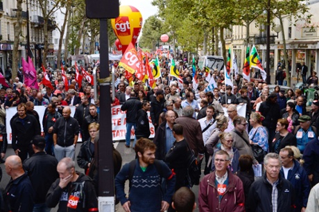 People march as part of a nationwide day of protest against the government's plans to reform France's debt-ridden pension system, on September 10, 2013 in Paris.