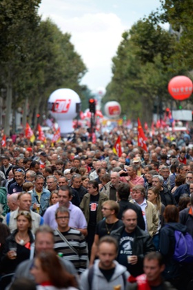 People march as part of a nationwide day of protest against the government's plans to reform France's debt-ridden pension system, on September 10, 2013 in Paris.