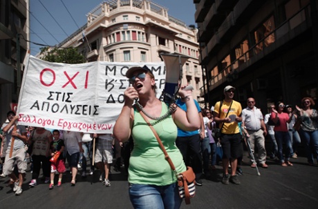 University employees and professors shout slogans during a rally over job layoffs, transfers and department closing in central Athens September 10, 2013.