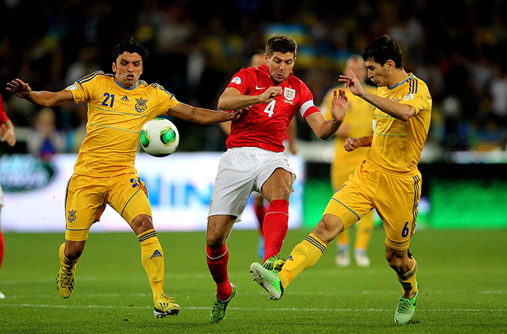 Ukraine v England: Steven Gerrard gets stuck in with Edmar and Taras Stepanenko 