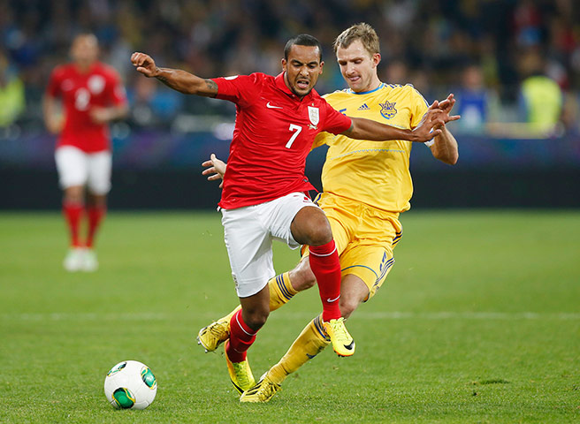 Ukraine v England: Olexandr Kucher fouls Theo Walcott