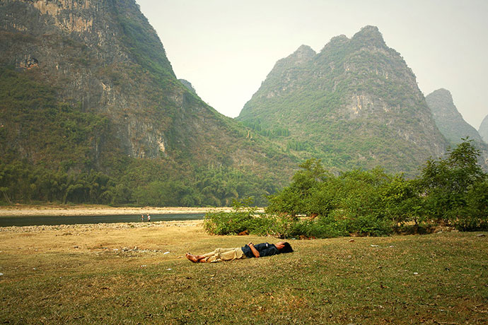 Big Picture - Daydreamers: Man lying on grass sleeping