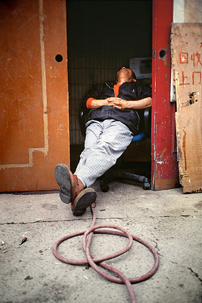 Big Picture - Daydreamers: Man sleeping inside doorway