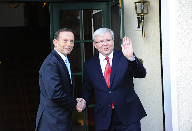 Lodge: Tony Abbott is greeted by caretaker prime minister Kevin Rudd