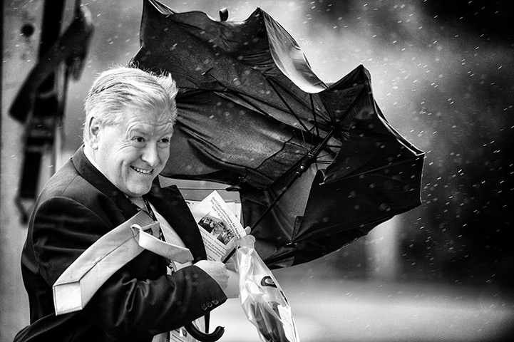 Lib Dem conference: Scottish broadcast journalist Bernard Ponsonby shelters from the wind 