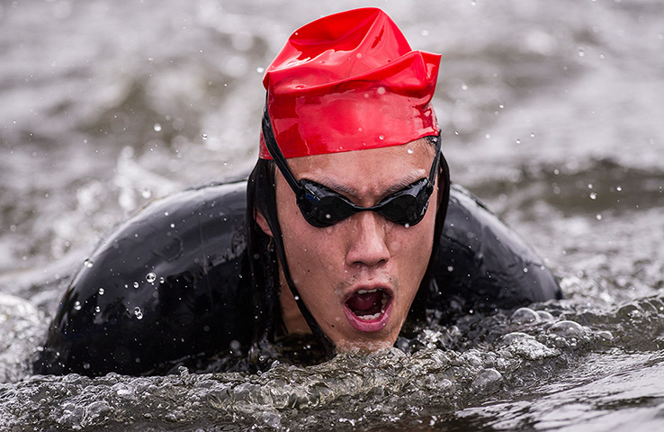 Amateur triathletes: Triathletes exiting the swim leg during the open races for amateurs during 