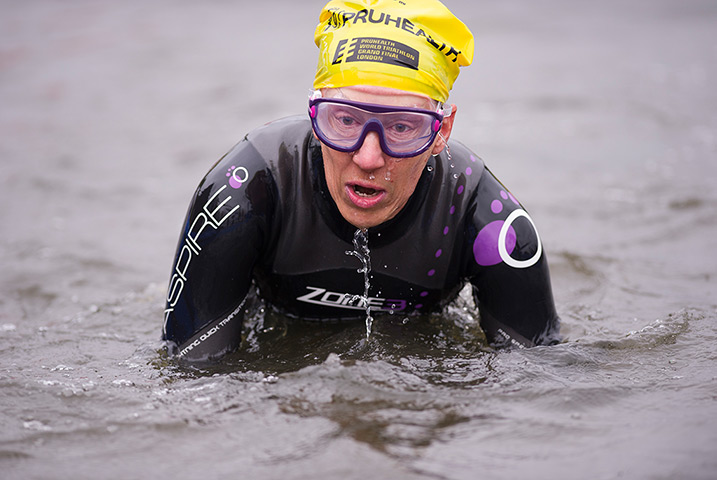 Amateur triathletes: Triathletes exiting the swim leg during the open races for amateurs during 