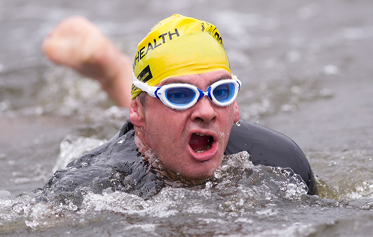 Amateur triathletes: Triathletes exit the swim leg during the open races