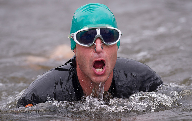 Amateur triathletes: Triathletes exiting the swim leg during the open races for amateurs during 
