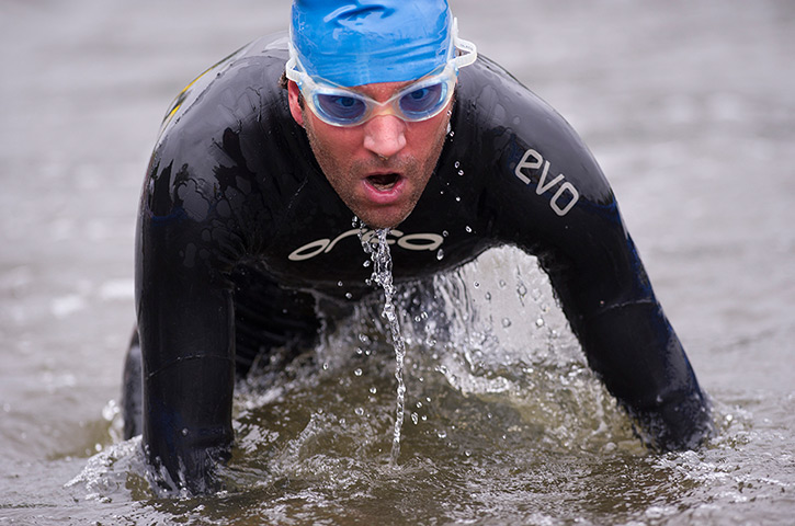 Amateur triathletes: Triathletes exiting the swim leg during the open races for amateurs during 