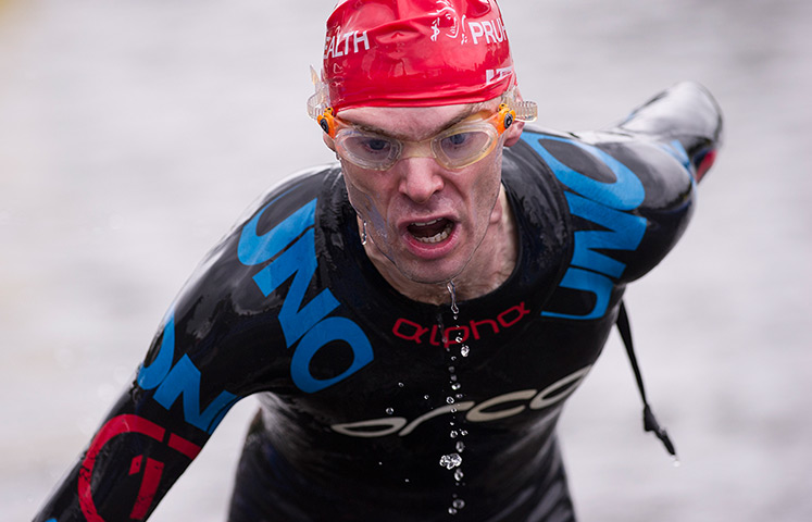 Amateur triathletes: Triathletes exiting the swim leg during the open races for amateurs during 