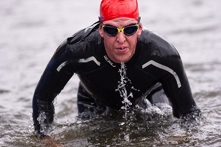 Amateur triathletes: Triathletes exiting the swim leg during the open races for amateurs during 