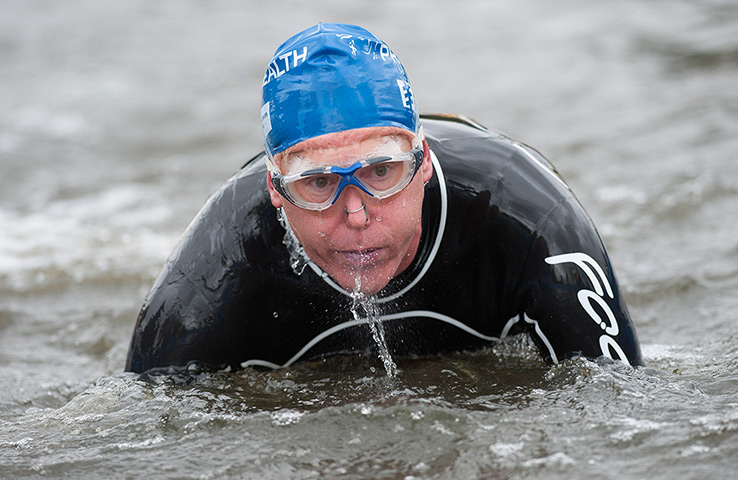 Amateur triathletes: Triathletes exiting the swim leg during the open races for amateurs during 