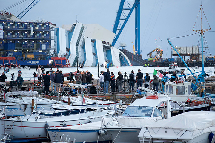 Concordia salvage: Reporters watch the Costa Concordia ship lying on its side 