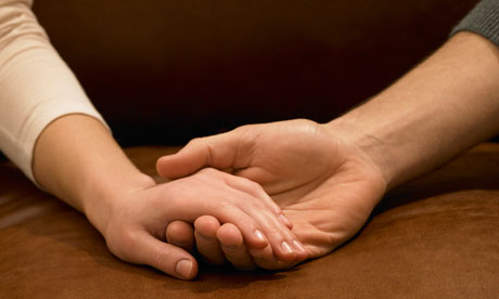 Young couple holding hands