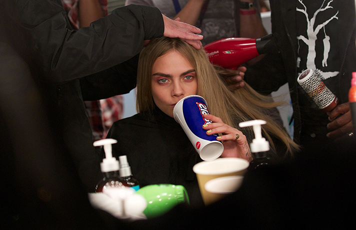 Burberry at LFW: Cara Delevingne gets her hair done for the Burberry show