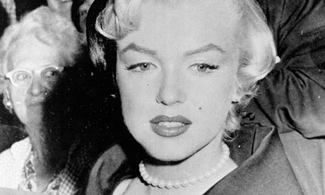 Marilyn Monroe wears the pearl necklace given to her by Joe DiMaggio.