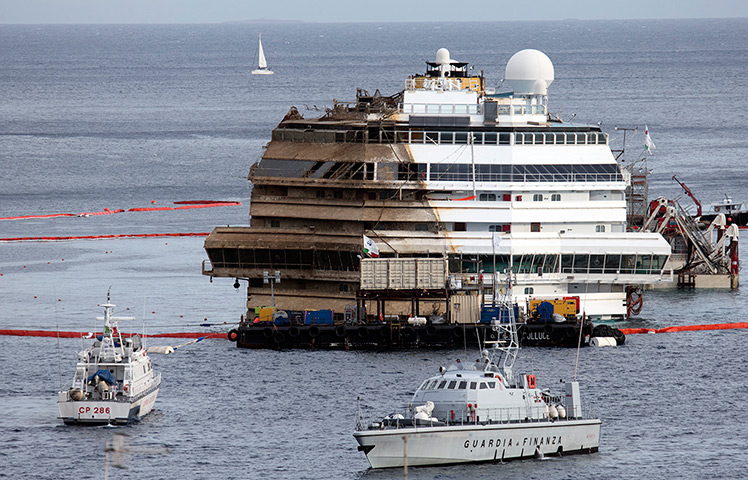 Concordia refloats: The Costa Concordia after it was was pulled completely upright early on Tue
