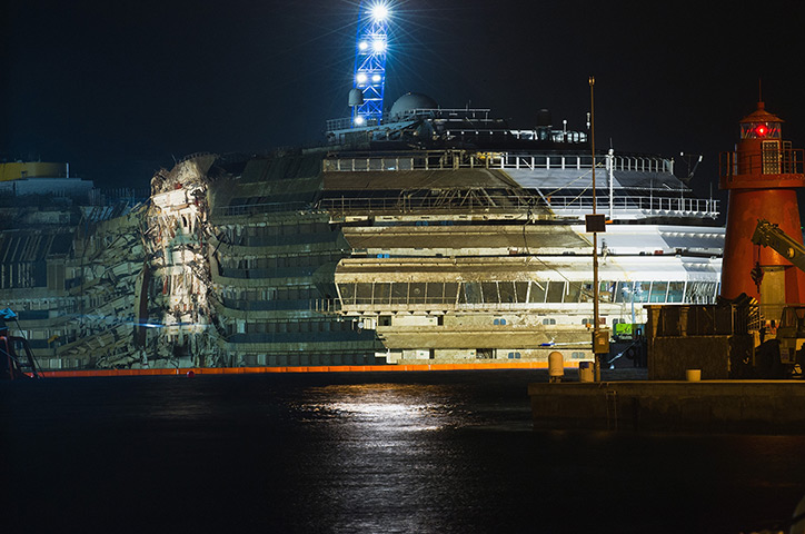 Concordia refloats: The severely damaged side of the stricken Costa Concordia is visible after 