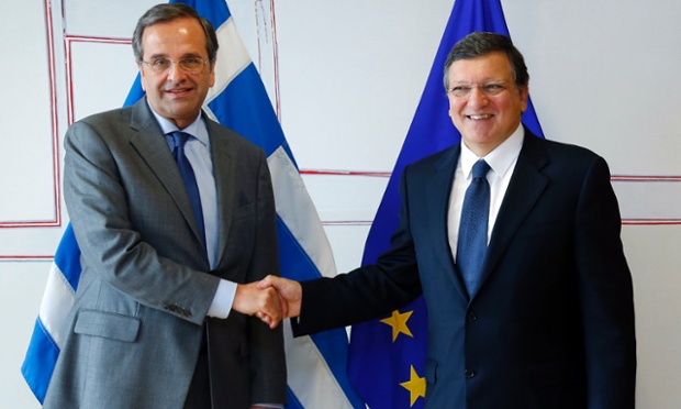 Greece's Prime Minister Antonis Samaras (L) is welcomed by European Commission President Jose Manuel Barroso (R) before their meeting at the EU Commission headquarters in Brussels September 17, 2013.