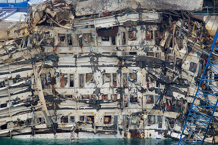 Concordia refloats pm: The severely damaged side of the stricken Costa Concordia is visible after the parbuckling operation 