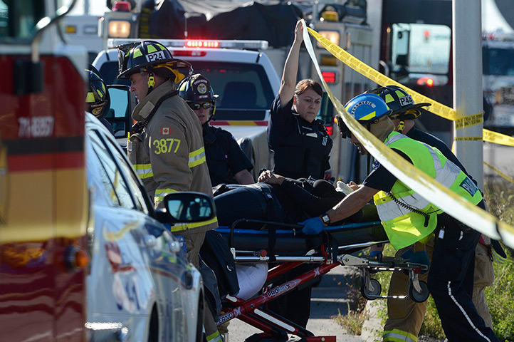 Ottawa crash: A passenger is taken to an ambulance. The injured from the bus who could wa