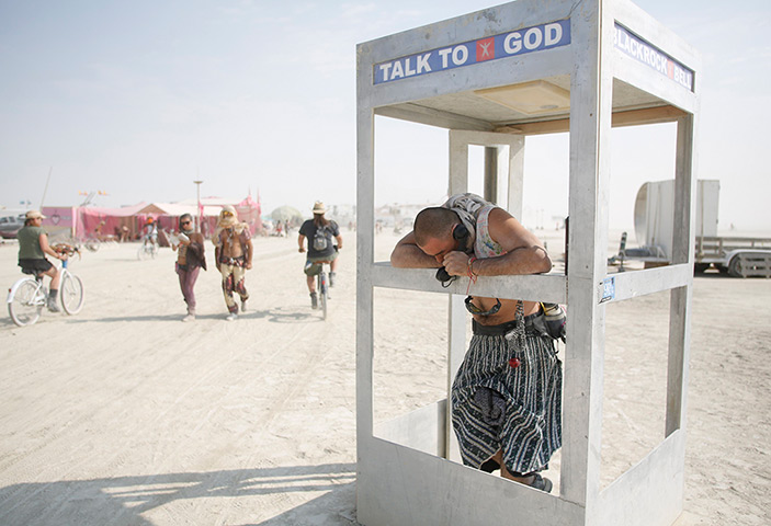 Burning Man 2013: Pippin, his Playa name, chats on the phone with God 