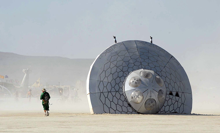 Burning Man 2013: A man walks past an art piece